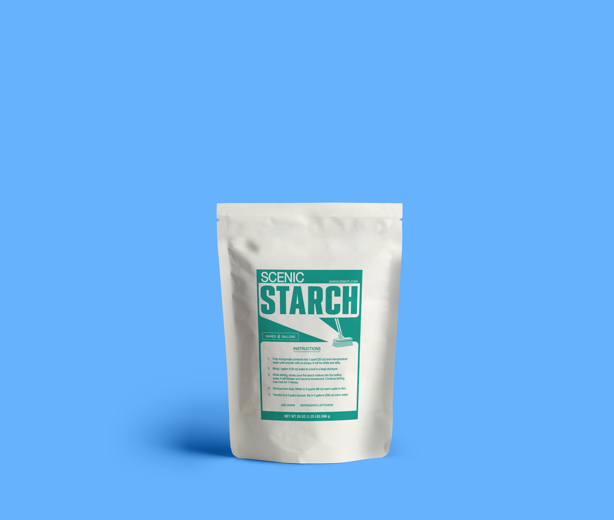 One white stand-up pouch of Scenic Starch stands against a solid blue background. Package features a teal and white label with the brand name 'SCENIC STARCH' and product details. Product sizes/prepares muslin backdrops for theatrical scenery.